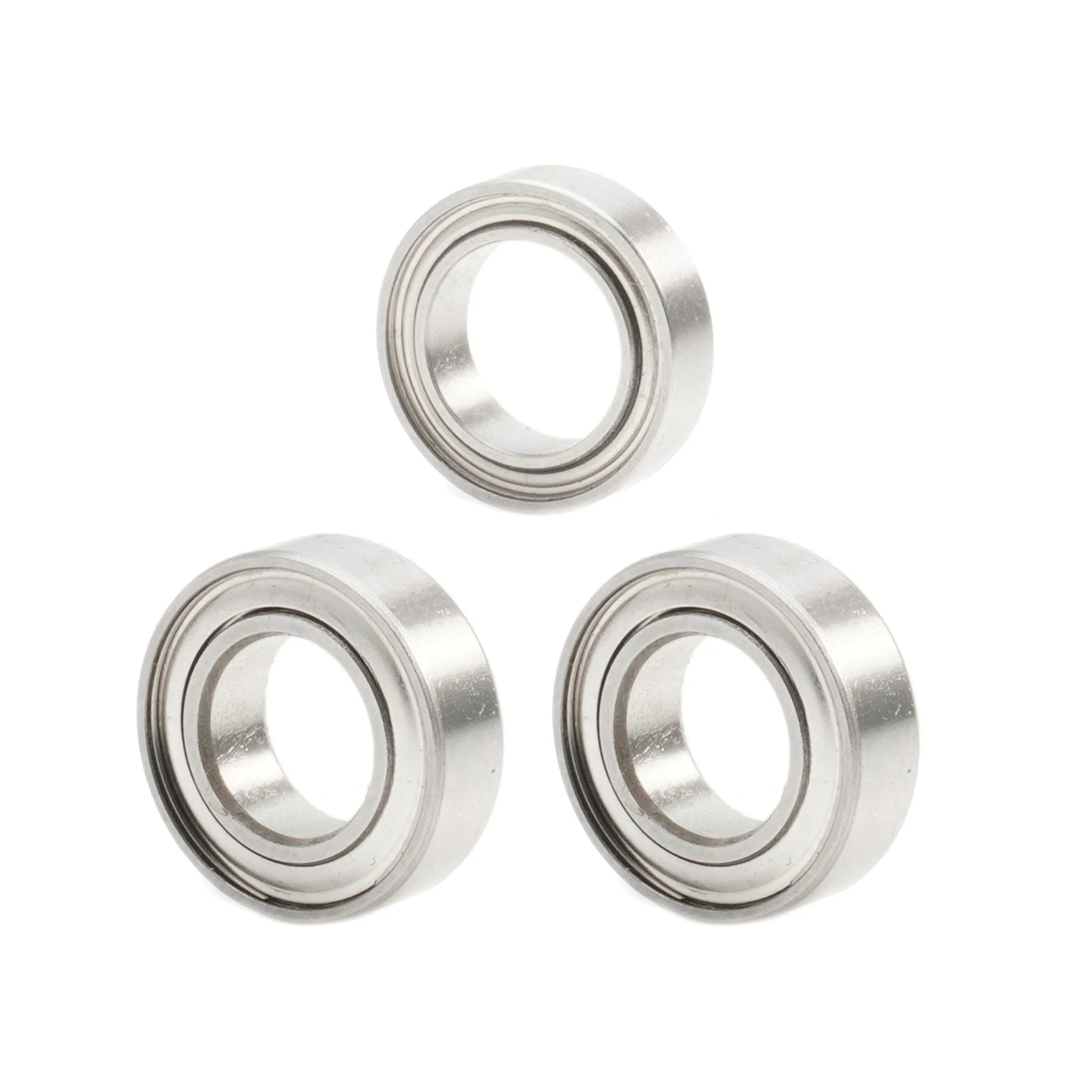 Three metal bearings on a white background