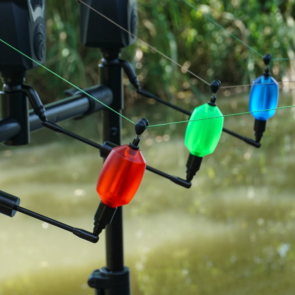 Fishing bite alarm swingers attached to rod pod setup