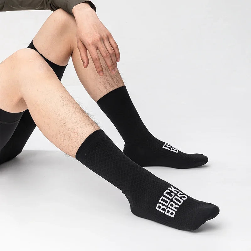 Black cycling crew socks worn for road riding