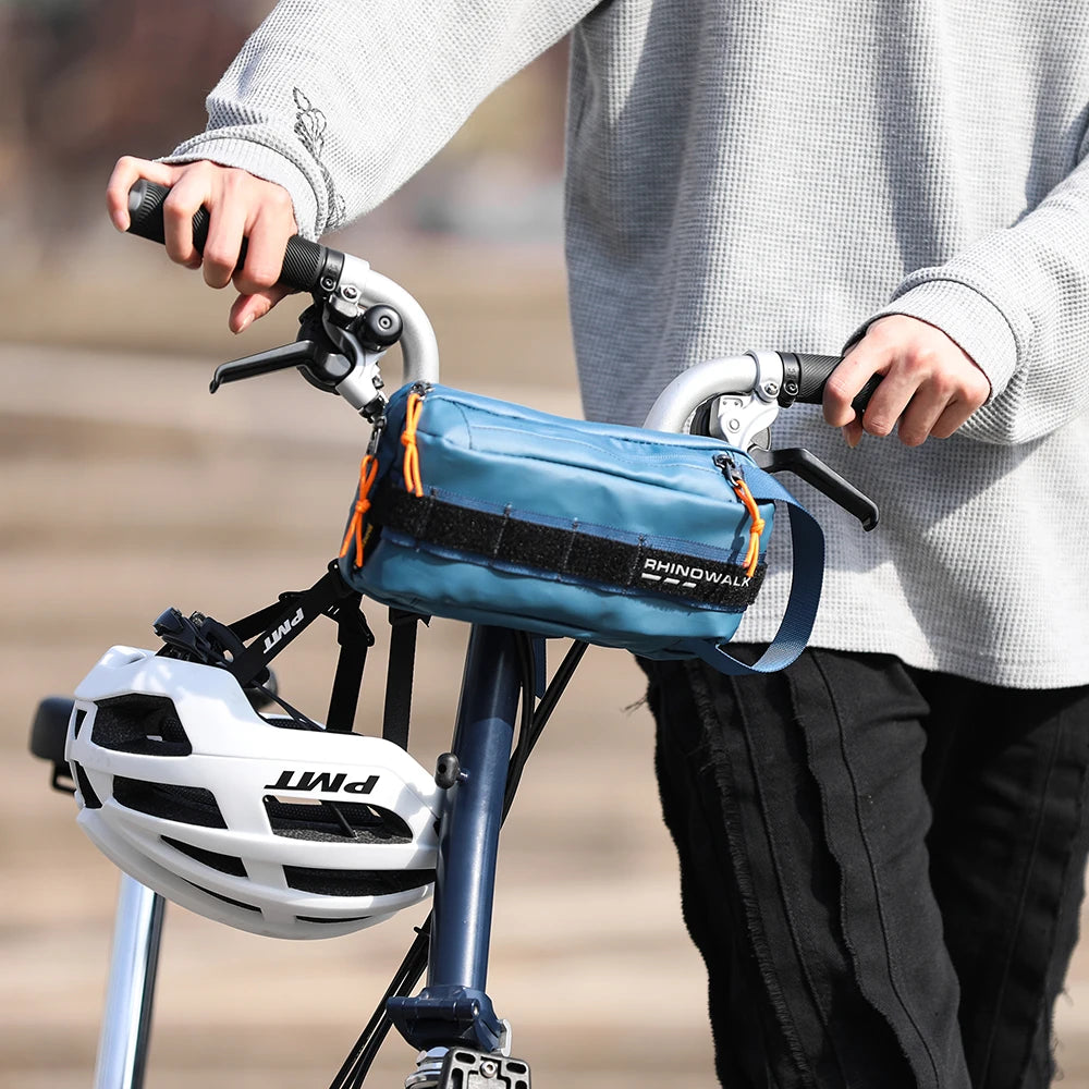 Blue waterproof handlebar bike bag on bicycle