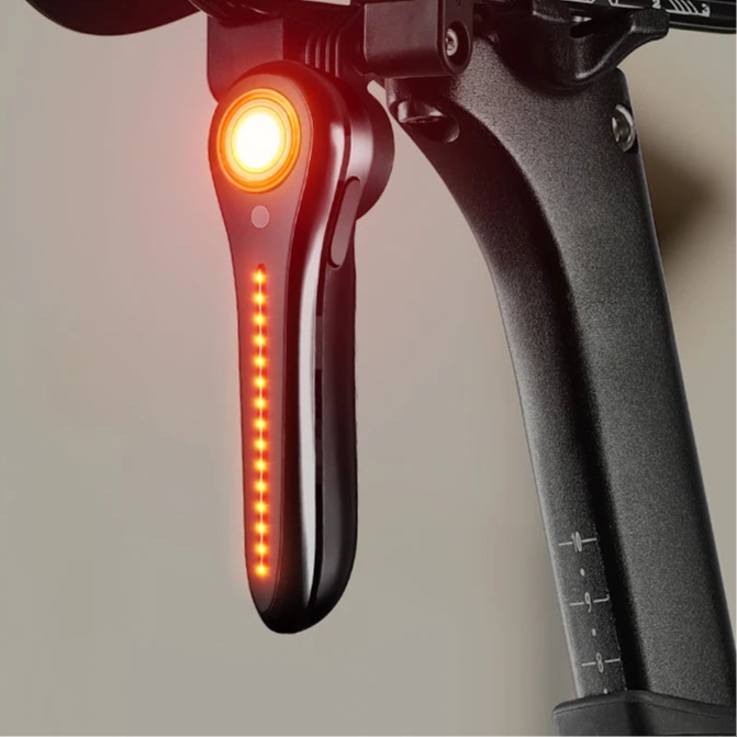 Smart rear bike light on bike saddle