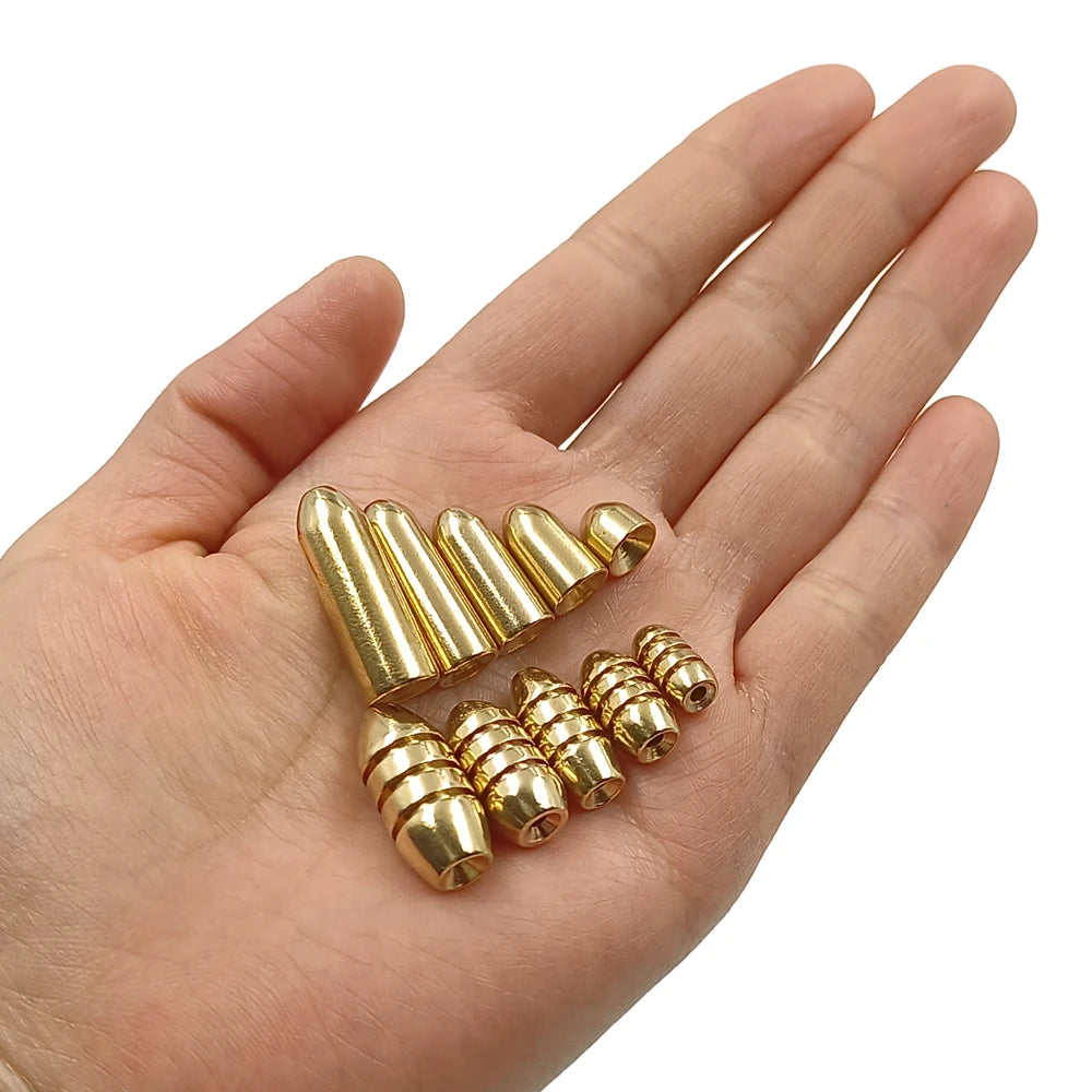 Brass bullet sinkers shown in hand for size reference