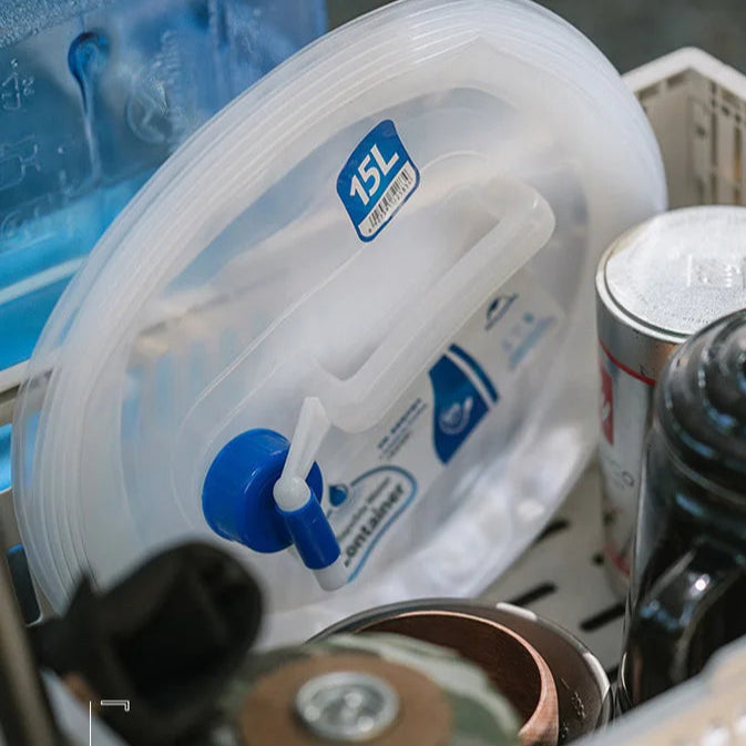 Collapsible water bucket filled inside kitchen sink