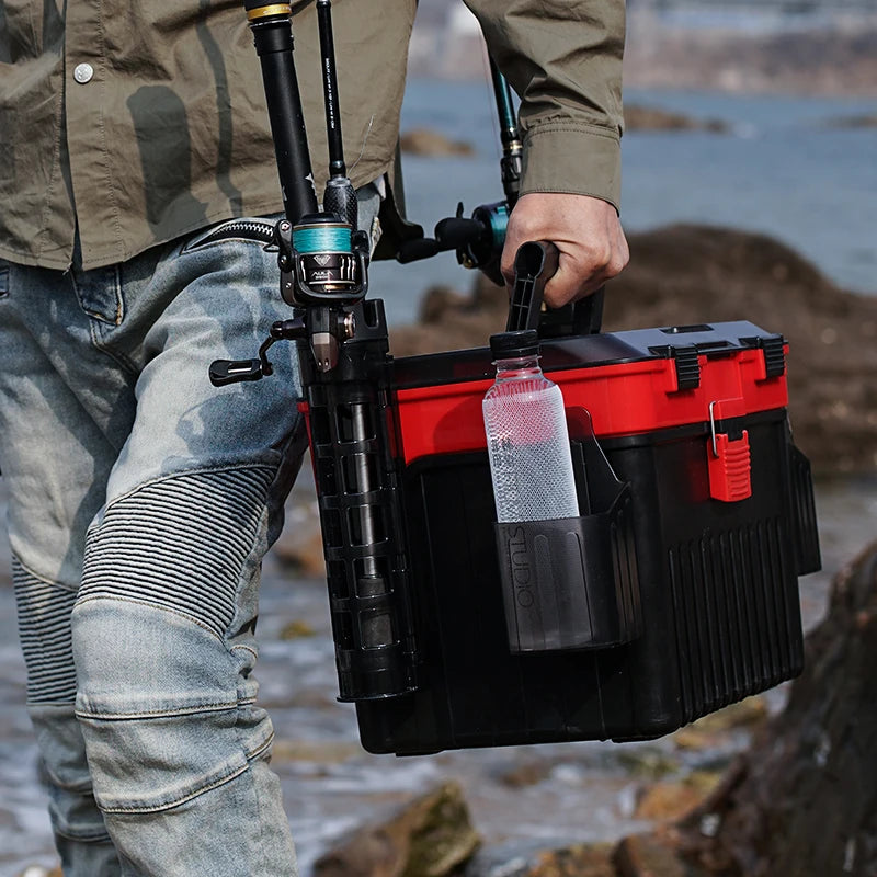 Double layer fishing workstation tackle box being carried