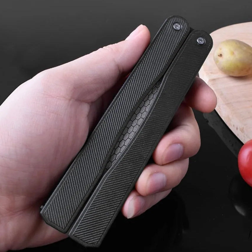 folding diamond hook and knife sharpener tool held in hand
