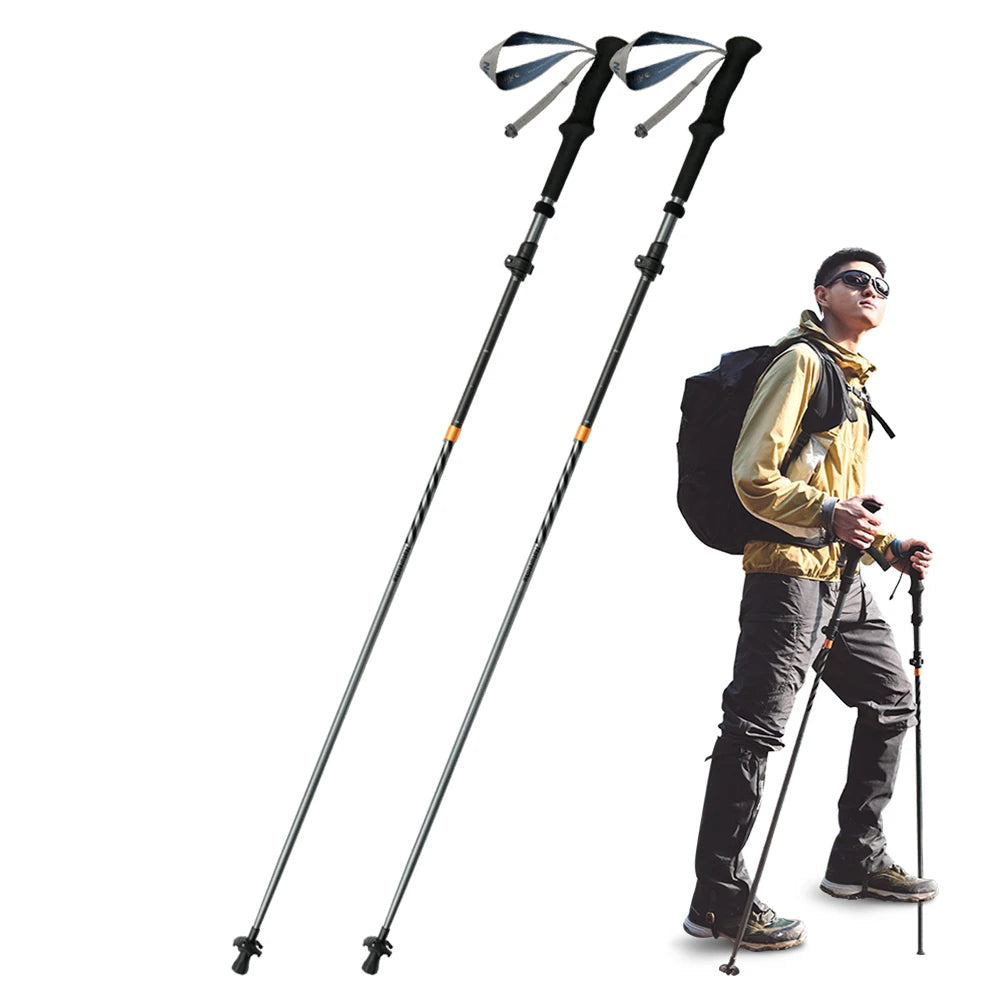 Folding trekking poles used by hiker on mountain trail