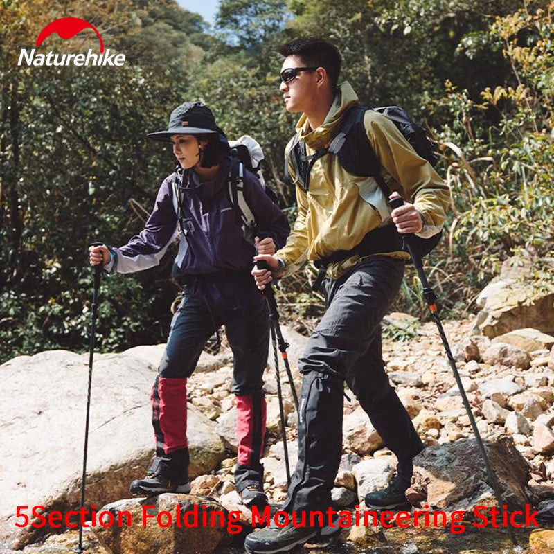 Two hikers using folding trekking poles on rocky trail