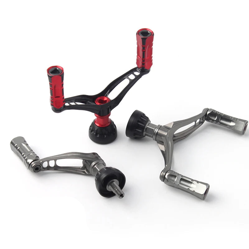 KAWA aluminium double reel handles in red and silver, showing precision-cut frames and ergonomic knob grips for spinning reels