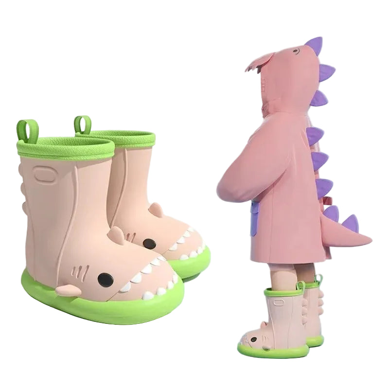 Child wearing waterproof shark design gumboots for wet weather play