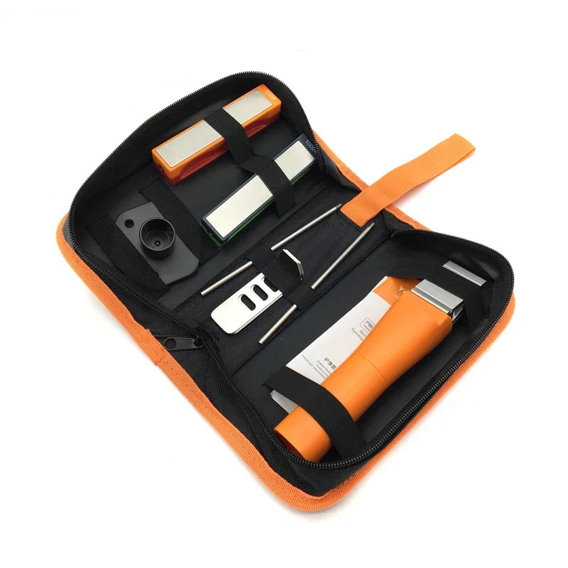 Knife sharpening kit with orange handle, stones, and tools neatly packed in carry case