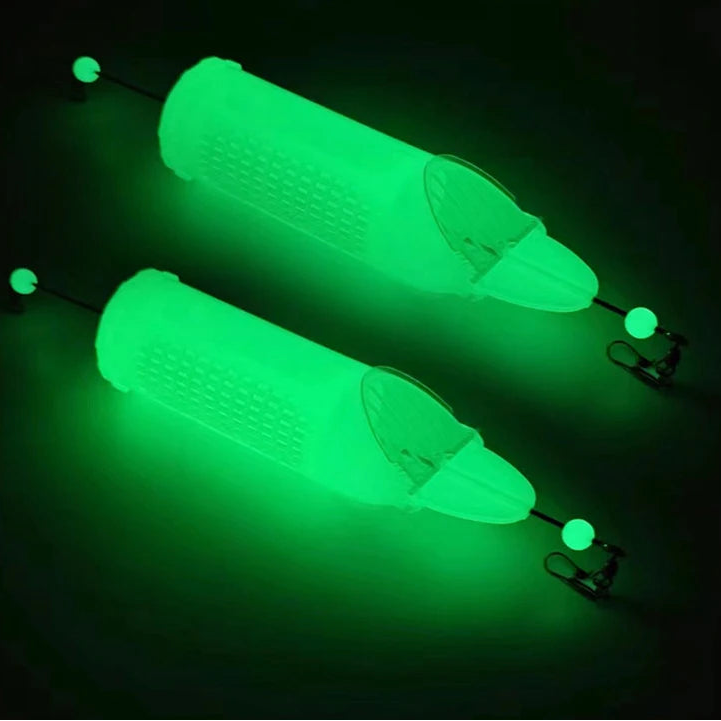 Luminous bait cage feeder glowing green for night fishing rigs