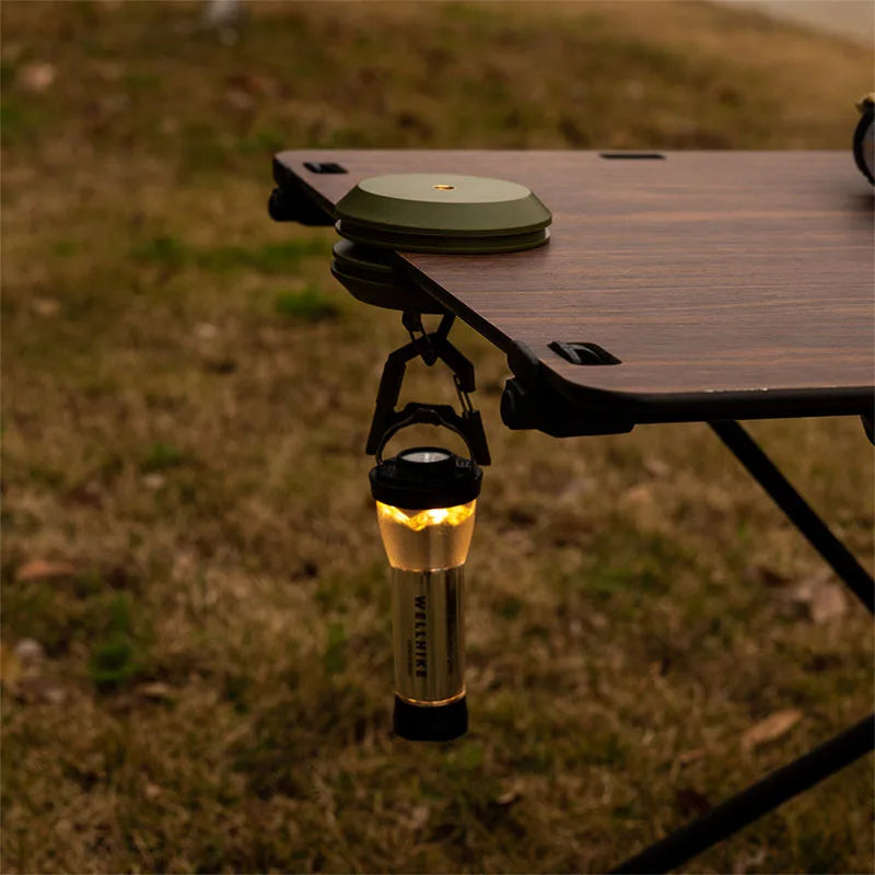 Magnetic hanging hook suspending lantern under camp table