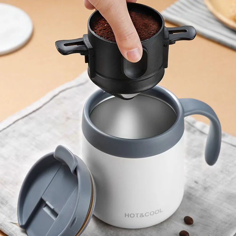 Compact stainless steel coffee dripper with mug and pot shown in use for camping or home brewing convenience