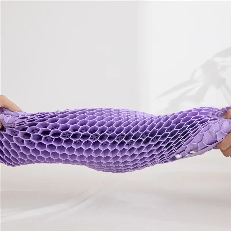 Purple gel pillow bent to show flexibility and structure