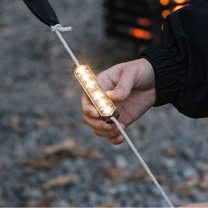 LED tent rope warning light clipped to guyline