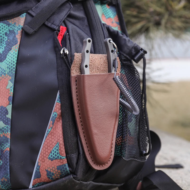 Titanium fishing pliers carried in leather belt sheath