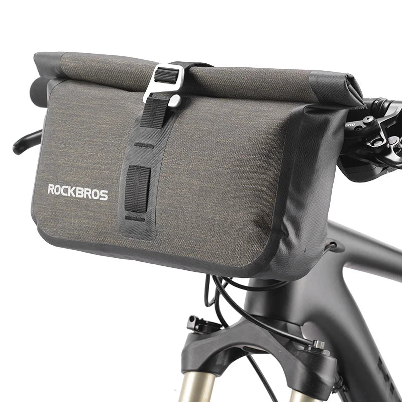 Waterproof roll top handlebar bike bag mounted on bicycle