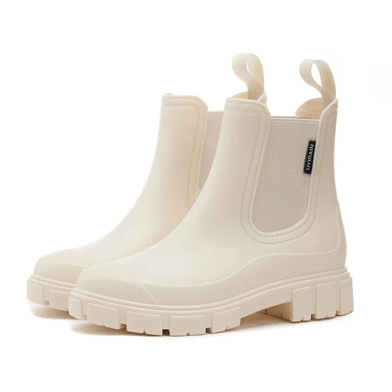 Women’s Chelsea ankle rain boots in cream with platform sole side view