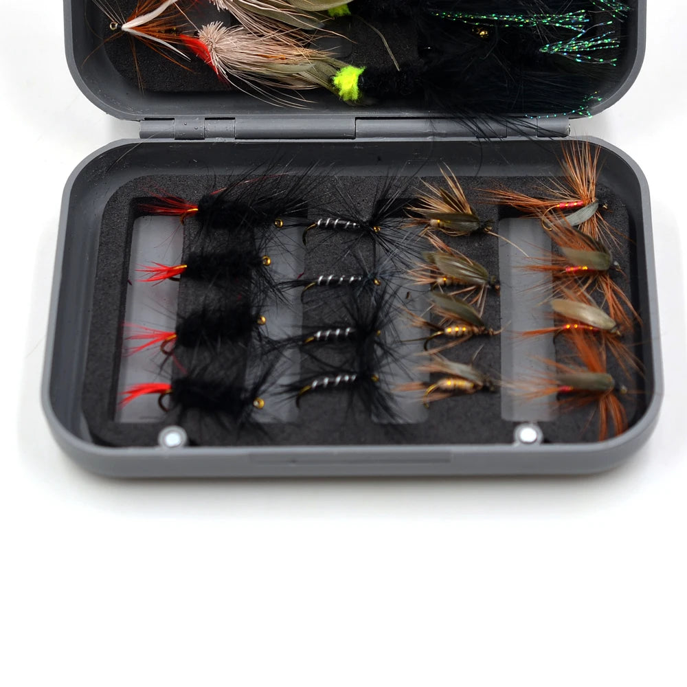 Assorted dry flies and streamers beside closed fly box
