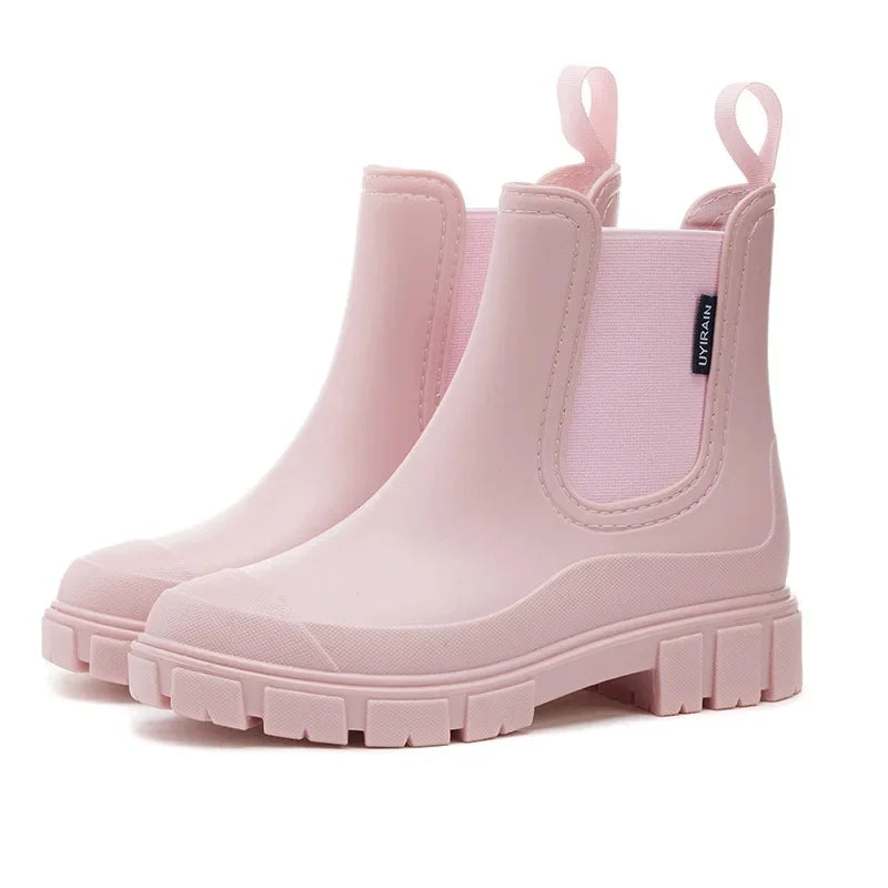 Women’s Chelsea ankle rain boots in pink with platform sole side view