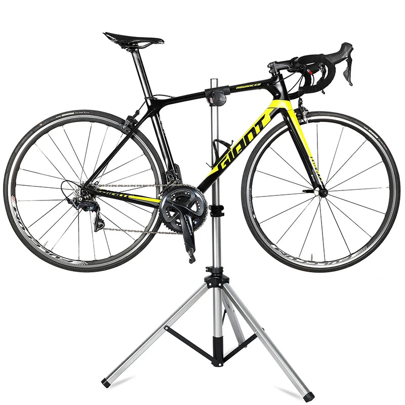 Adjustable foldable bike repair stand holding road bike