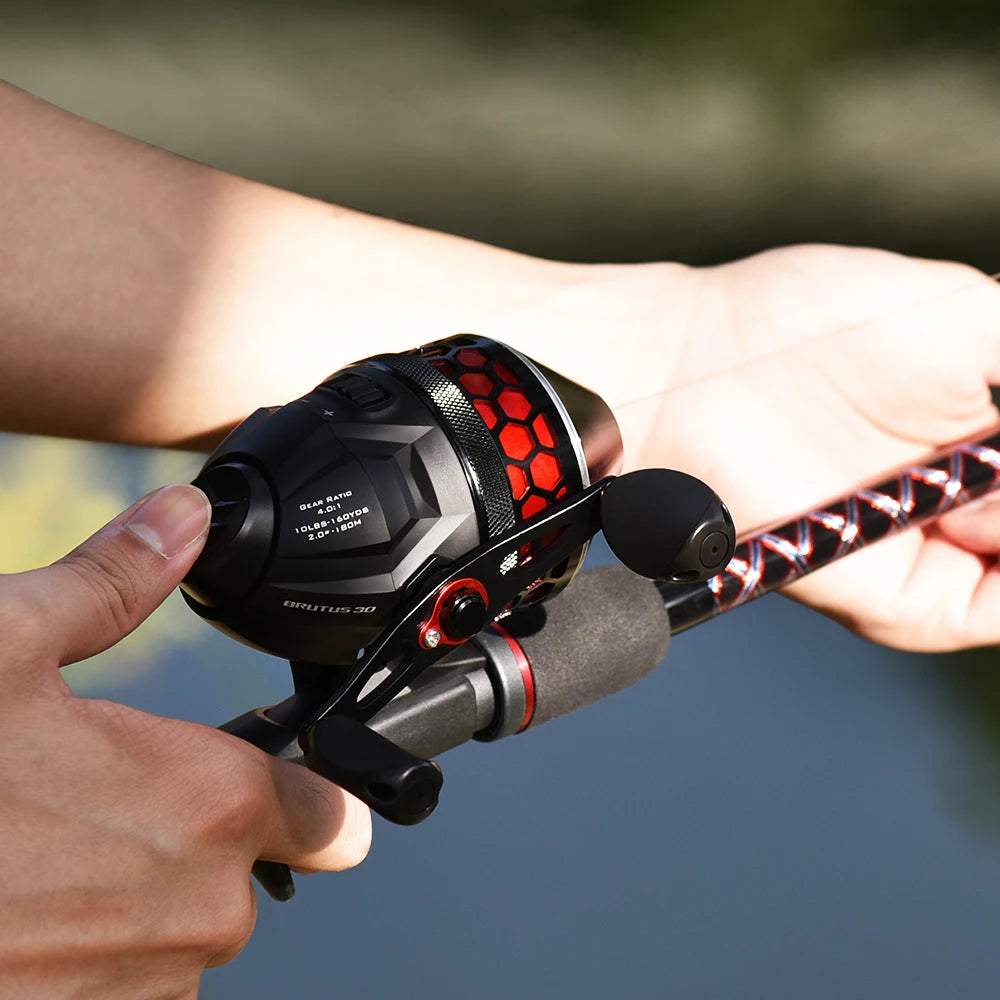Angler holding spincast reel in hand, showing smooth thumb-button casting action and ergonomic grip for relaxed fishing
