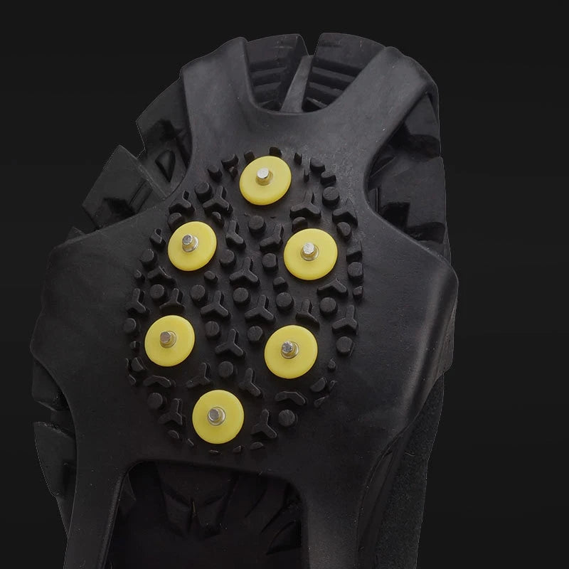 Steel traction claws close up mounted on anti slip shoe covers