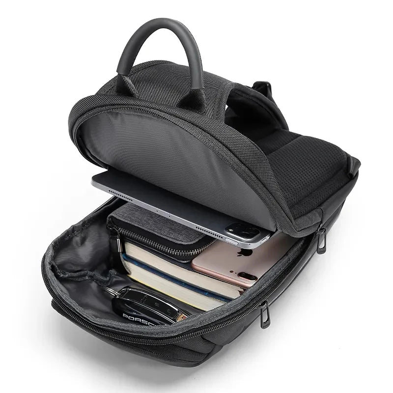 BANGE crossbody sling bag open showing laptop, phone, and organiser compartments for daily essentials