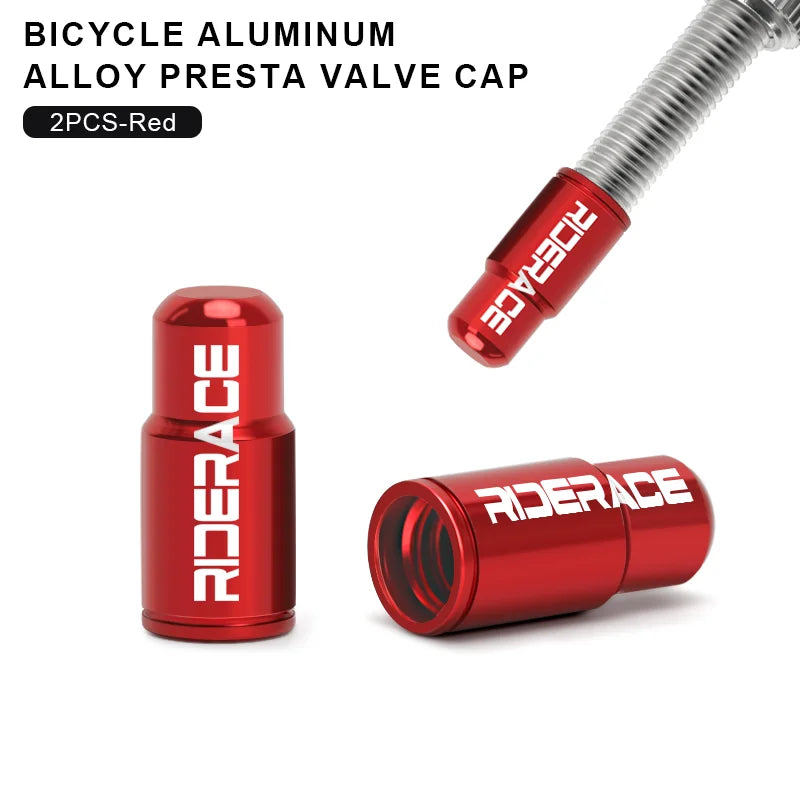 Pair of red aluminium Presta valve caps fitted to bicycle valve stems
