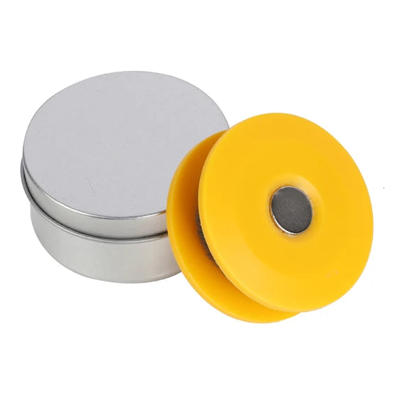 Bike chain lubricator roller tool stored inside metal tin