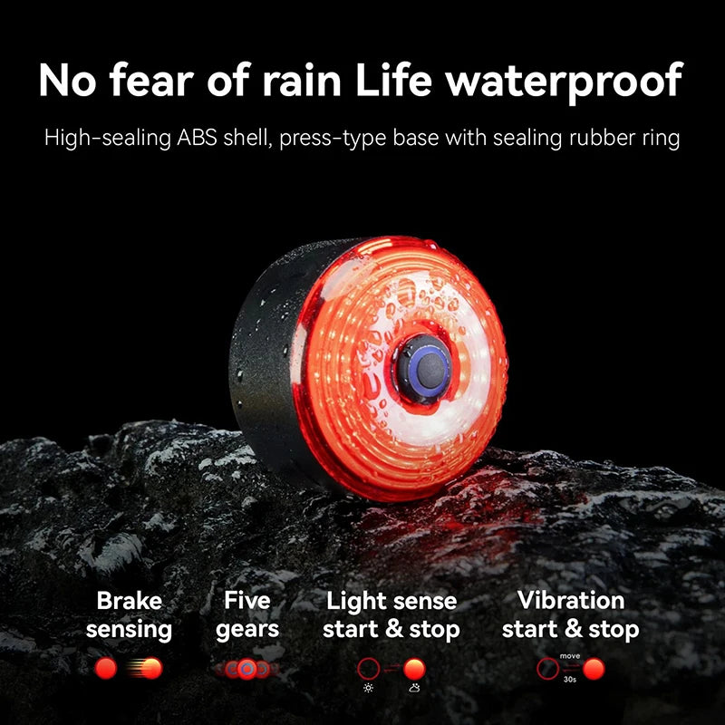 Rear bike light shown illuminated in rain conditions