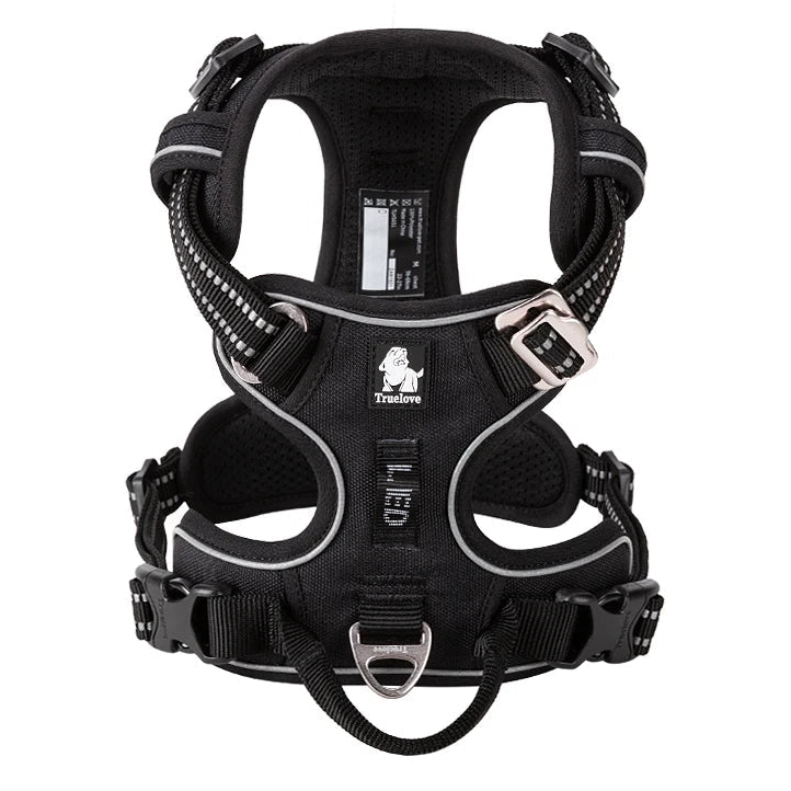 Black padded dog harness with reflective trim and front ring