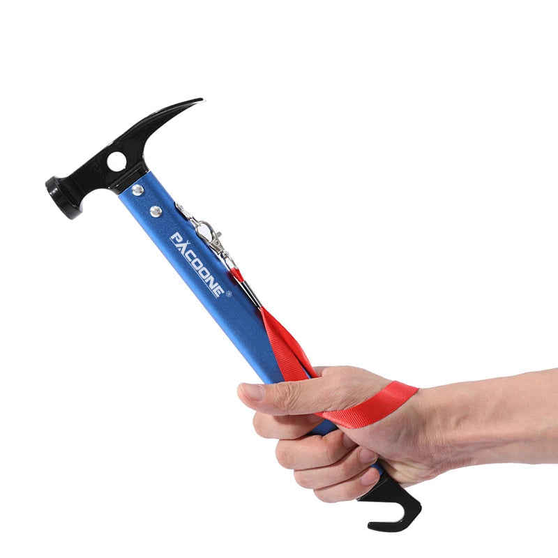 Blue camping hammer held in hand close up