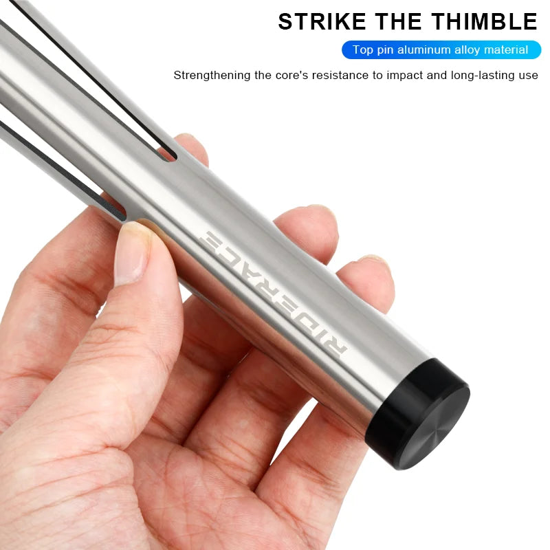 Bottom bracket bearing removal tool shown in hand for scale