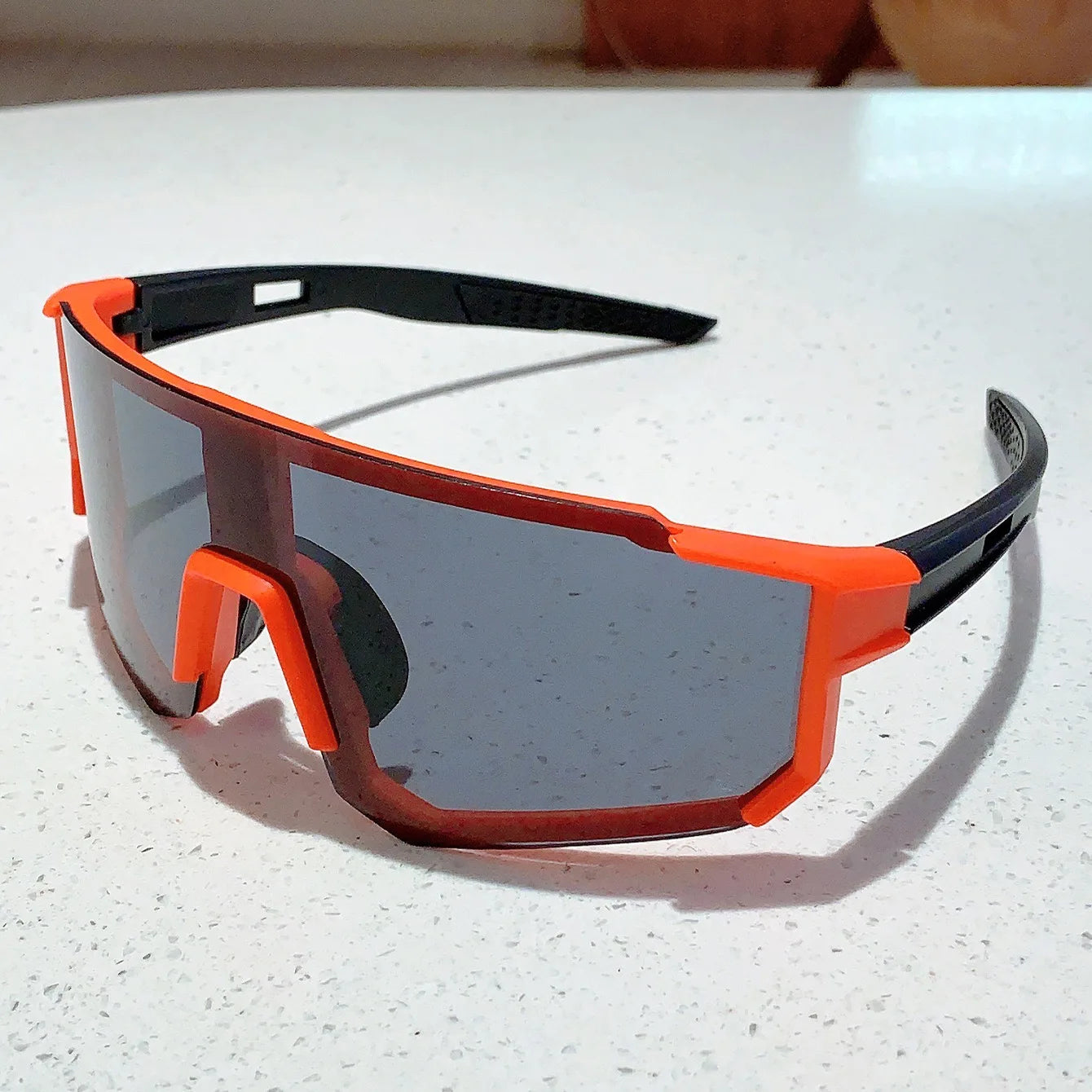 BUYUTEEN orange sport goggles with mirrored lenses, designed for cycling and snow sports