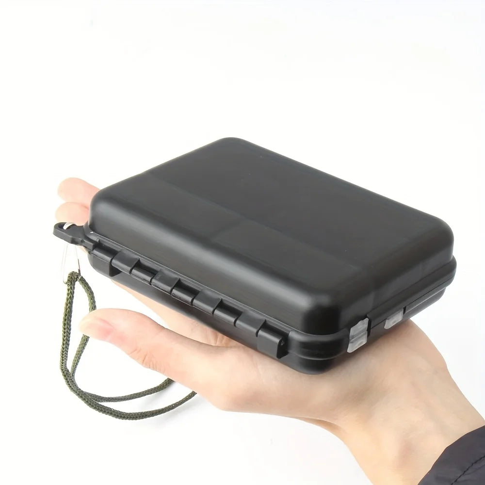Compact fishing tackle box with secure clasp and hand strap for easy carrying