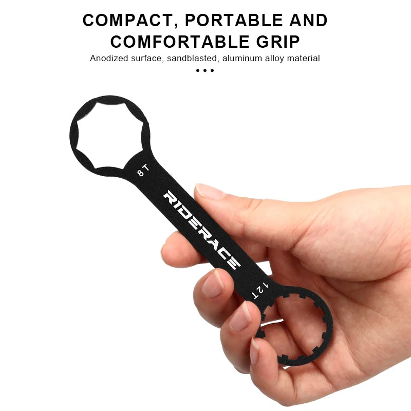 Compact bicycle fork cap wrench held in hand