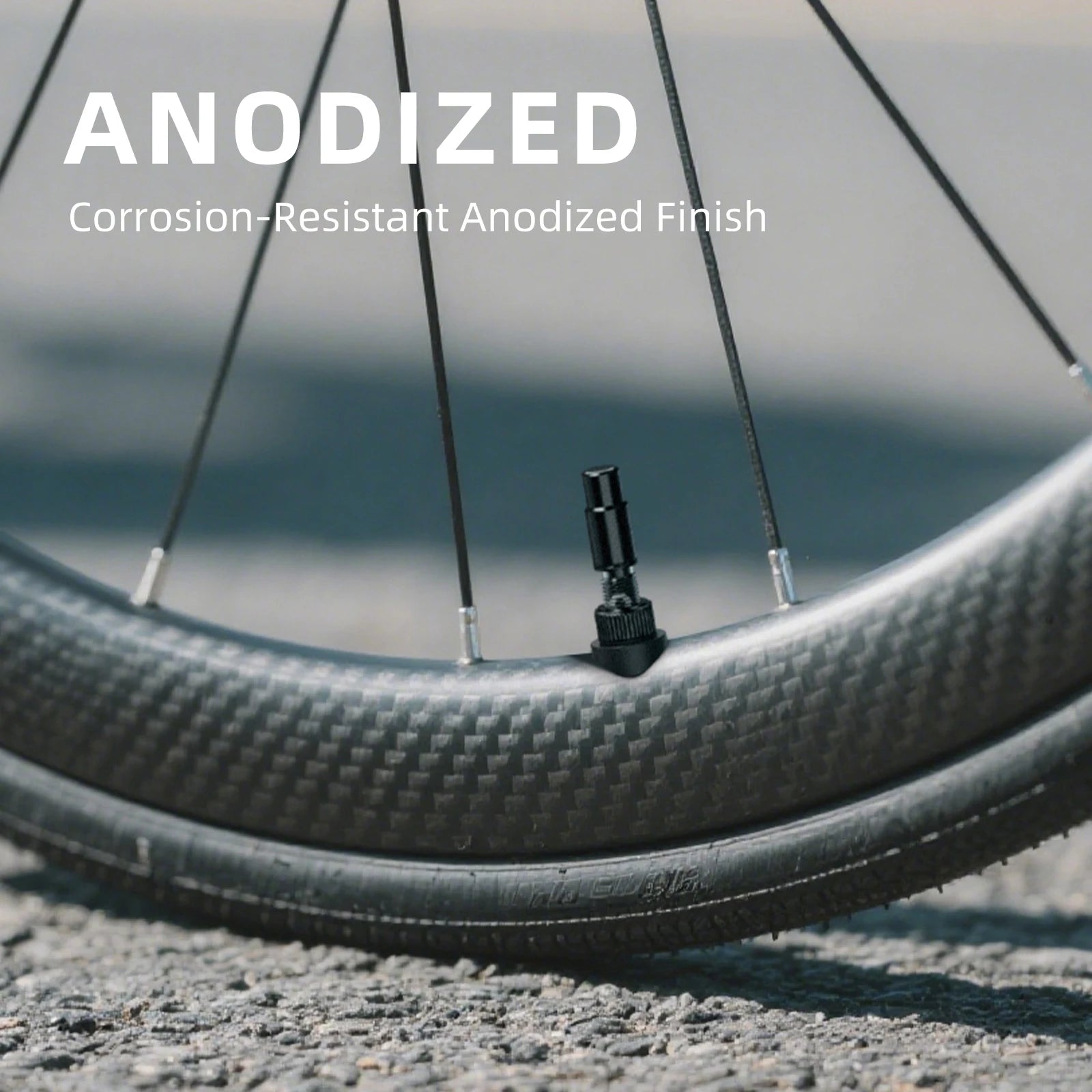 CYCLAMI anodized aluminium tubeless Presta valve fitted on carbon wheel rim showing corrosion resistance