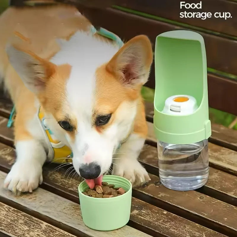 Dog drinking from travel water bottle with food container