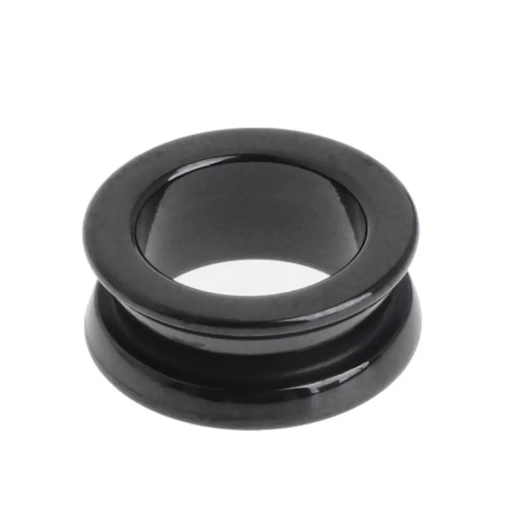 Two black ceramic line rollers for fishing reel maintenance and repair