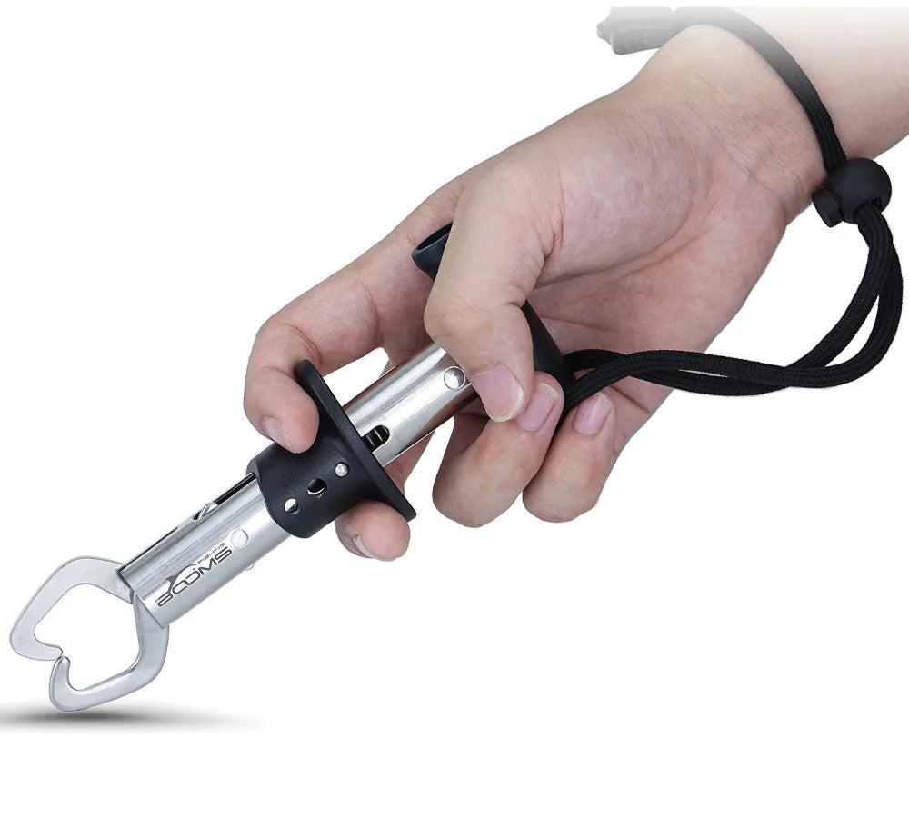 angler holding fish grip tool during hook removal