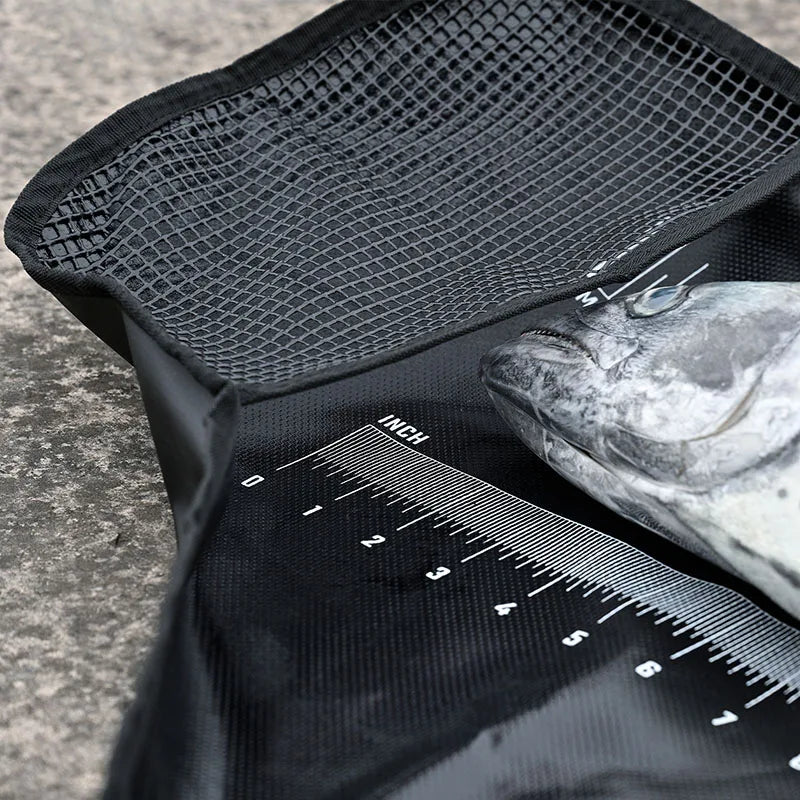 Fish measuring bag showing mesh pocket and waterproof lining
