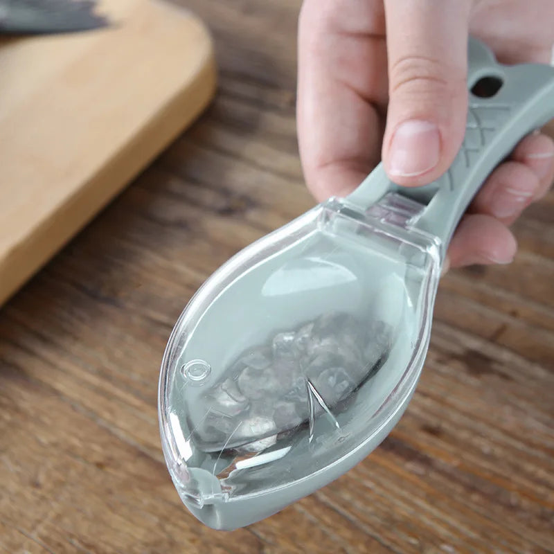 Fish scale scraper with clear protective cover closed