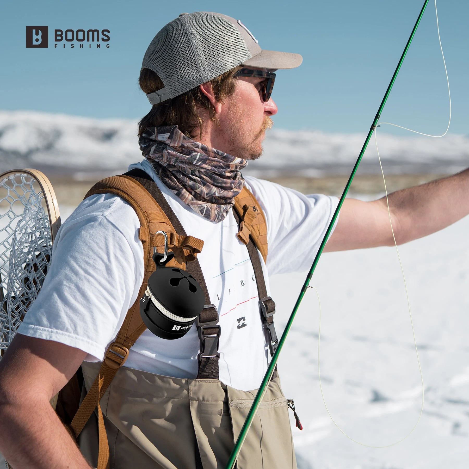 Fishing line holder attached to vest during fishing