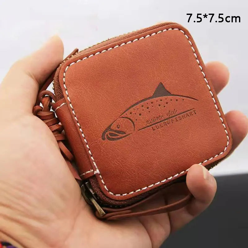 Small fishing lure wallet held in hand