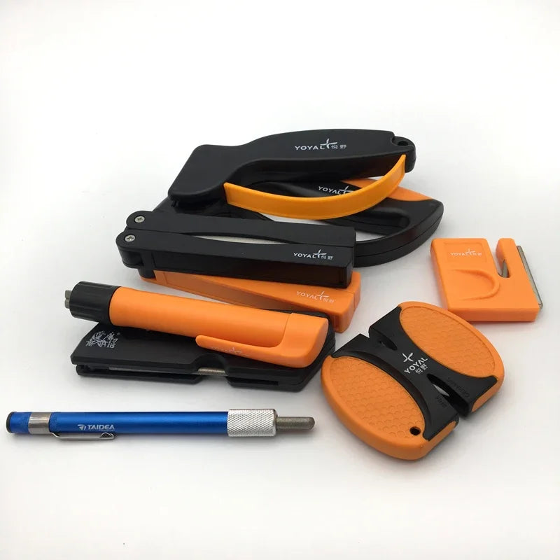 Selection of individual fishing tools including knife sharpeners and small tackle accessories