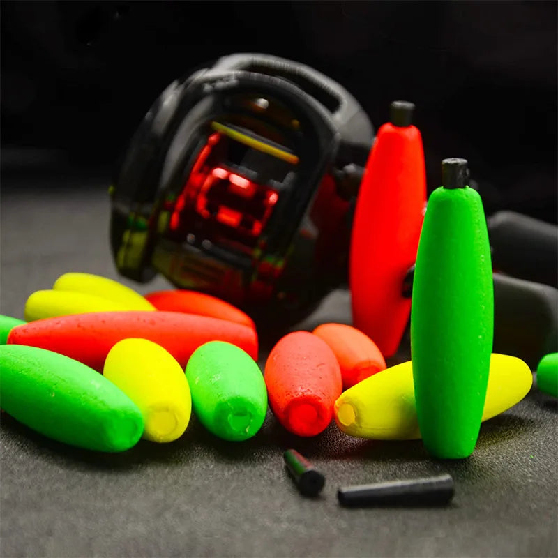 Colourful foam fishing floats beside reel and tackle ready for float fishing