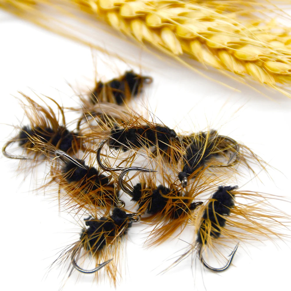 Group of gold head worm style trout flies together