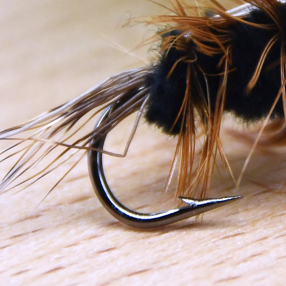 Gold head worm trout fly hook and body close-up