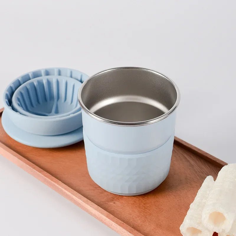 Stainless steel coffee cup with reusable silicone filter designed for hand-brewed coffee on the go